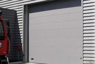 Installation et pose de portes sectionnelles isolées en Bretagne